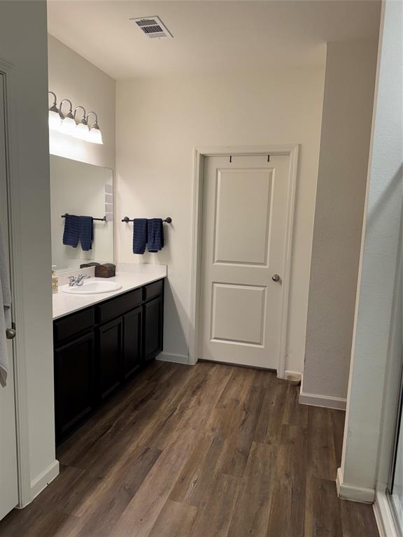2209 Cinnamon Spgs Road Glenn Heights, TX 75154 - Photo 7 of 28 Bathroom featuring a dark wood-finish vanity with a white countertop and integrated sink