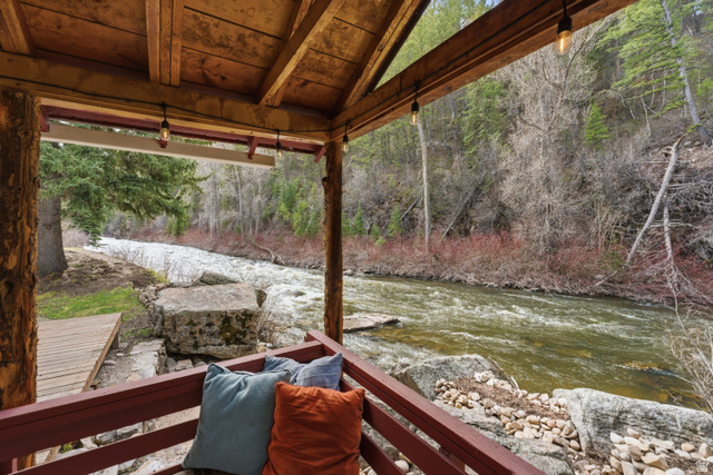 6631 Pine Springs Road Kamas, UT 84036 - Photo 2 of 48 Wooden terrace featuring a water view and a wooded view