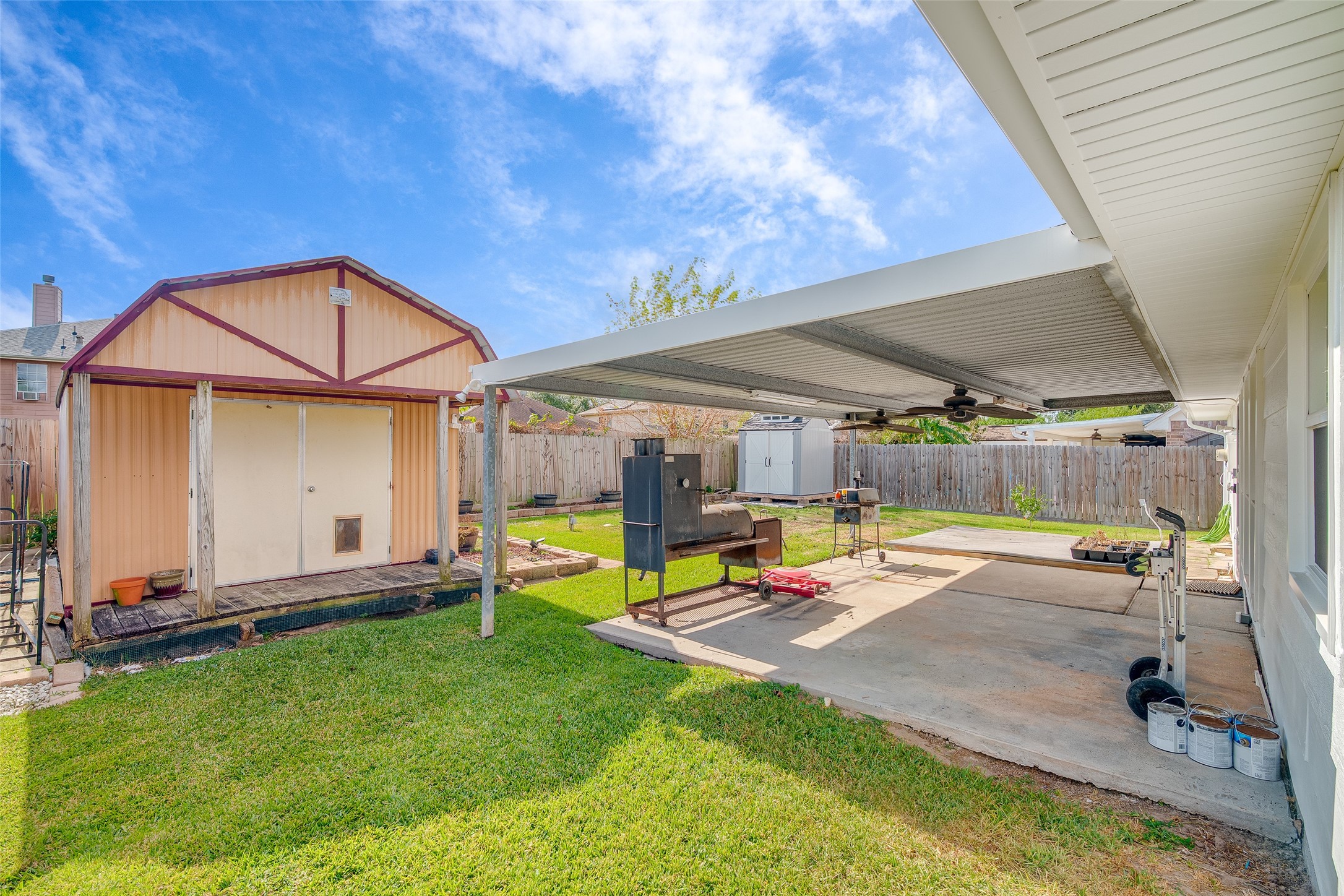 4826 Stonebridge Street Baytown, TX 77521 - Photo 12 of 18 The backyard includes a large, versatile shed, perfect for storage, hobbies, or creating your own personalized workspace.