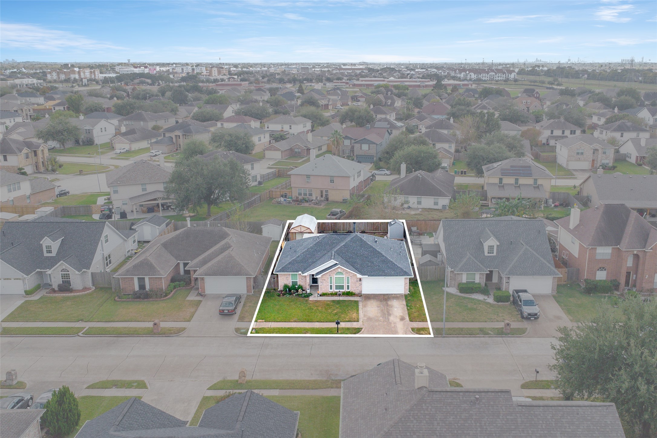 4826 Stonebridge Street Baytown, TX 77521 - Photo 15 of 18 An aerial view showcases the front of the home, highlighting its curb appeal and surrounding property.