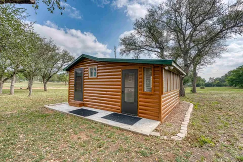 a bathroom with a tub sink and a large window