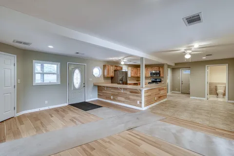a view of a kitchen counter top space cabinets and stainless steel appliances