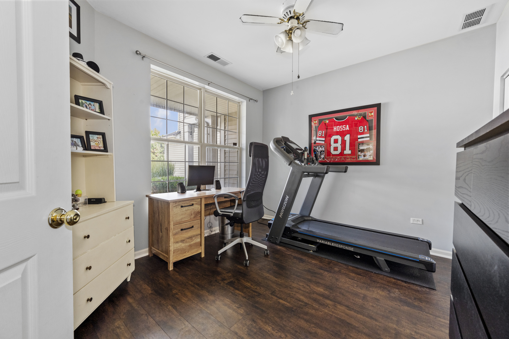 24011 Pear Tree Circle Plainfield, IL 60585 - Photo 15 of 31 a room with gym equipment and a window