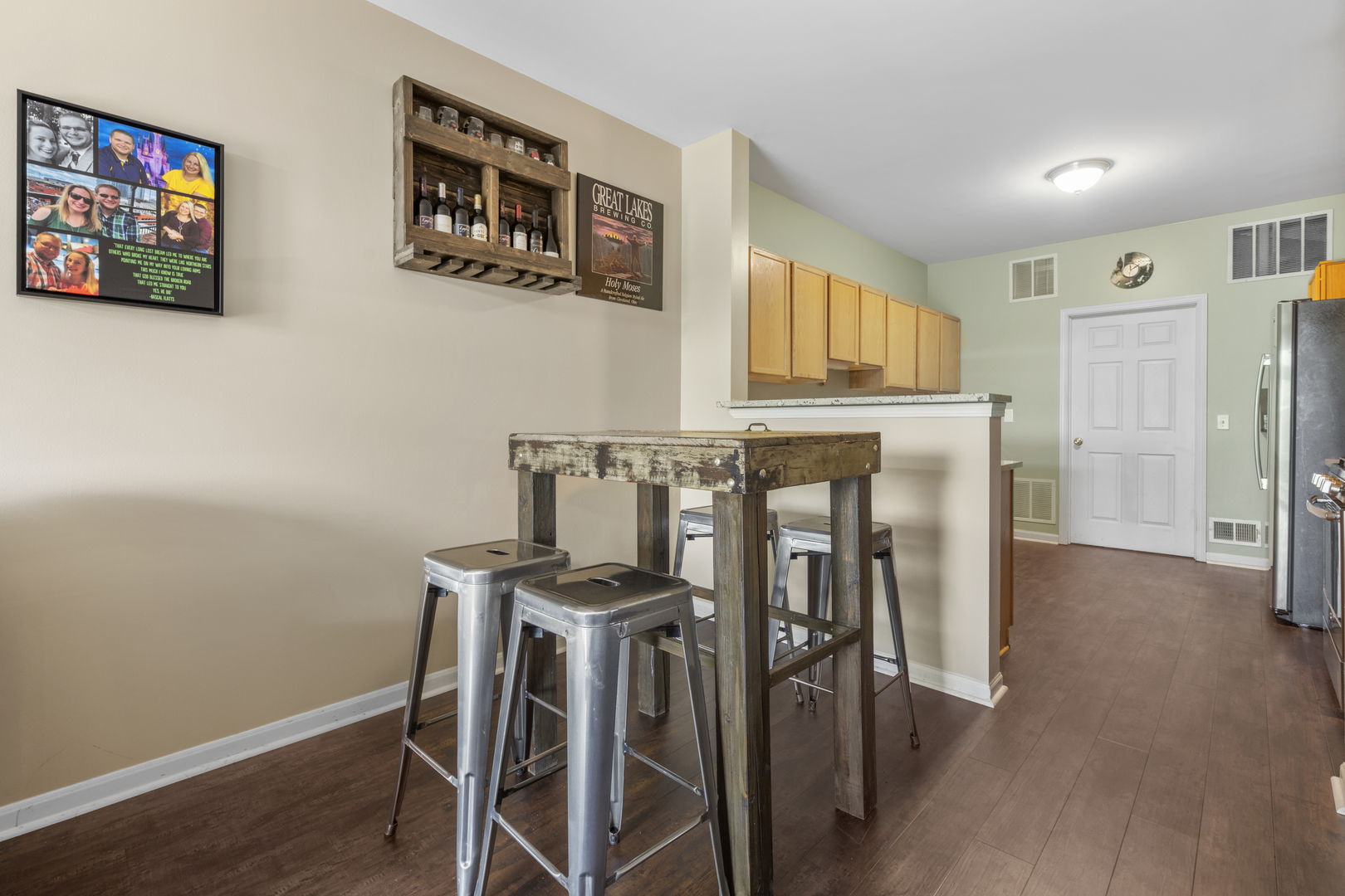 24011 Pear Tree Circle Plainfield, IL 60585 - Photo 7 of 31 a view of a dining room with furniture and wooden floor