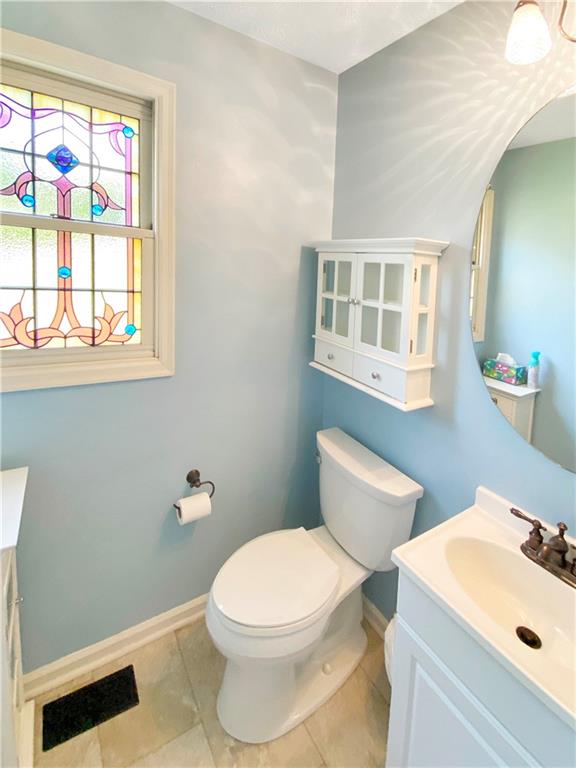 206 Ruth Way McDonald, PA 15057 - Photo 14 of 35 First floor powder room has a stained glass window.