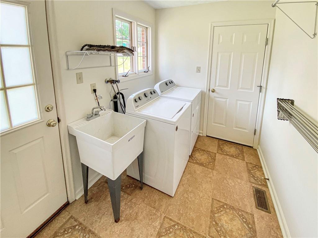 206 Ruth Way McDonald, PA 15057 - Photo 16 of 35 Convenient first floor laundry with door to the back yard. Connects kitchen to the garage.