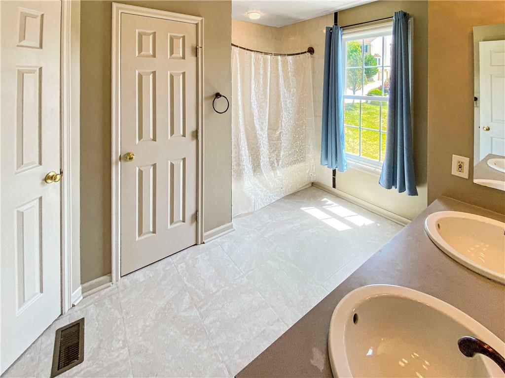 206 Ruth Way McDonald, PA 15057 - Photo 19 of 35 The master bath has a dual bowl vanity sink, walk-in closet plus another closet.