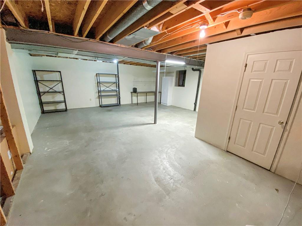 206 Ruth Way McDonald, PA 15057 - Photo 29 of 35 Huge unfinished basement area. Crawl space storage.
