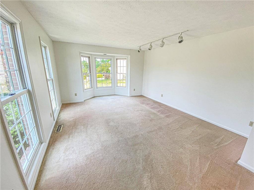206 Ruth Way McDonald, PA 15057 - Photo 3 of 35 The light and bright living room features a bay window.