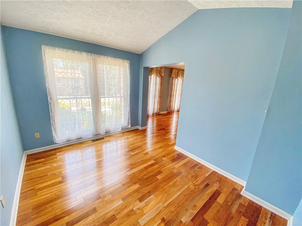 206 Ruth Way McDonald, PA 15057 - Photo 6 of 35 There is a den/home office adjacent to the dining room that features a vaulted ceiling.