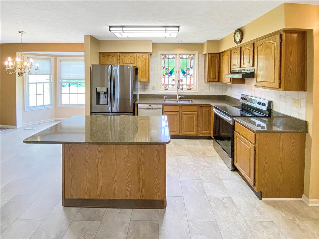 206 Ruth Way McDonald, PA 15057 - Photo 8 of 35 The kitchen features granite countertops.