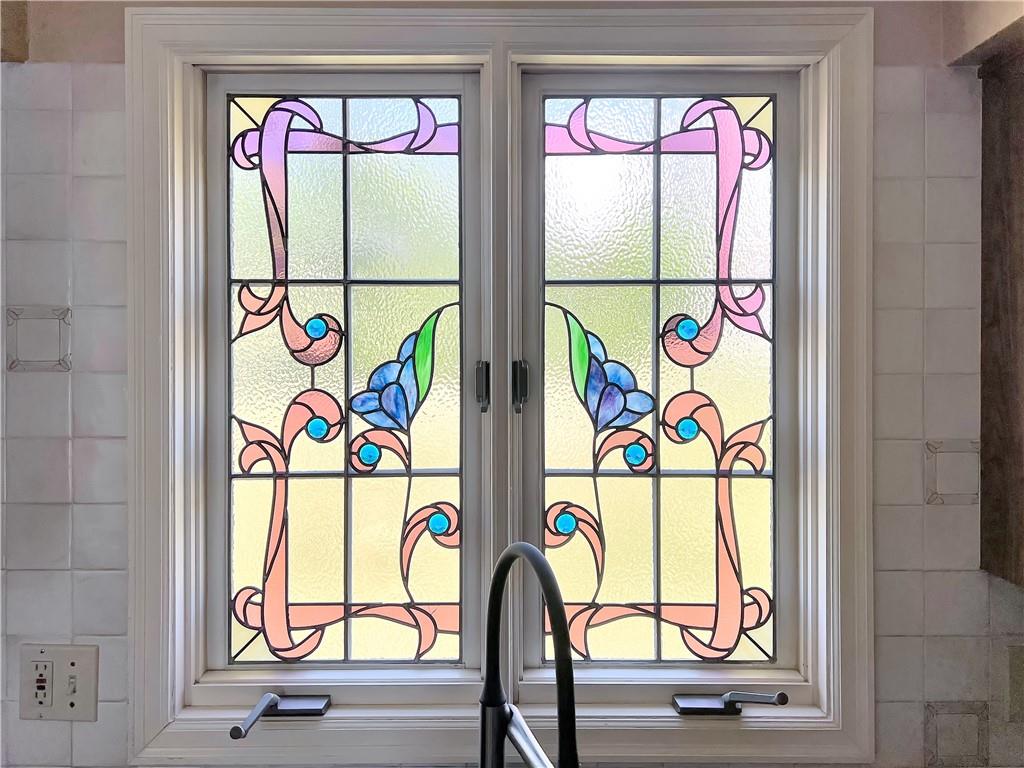 206 Ruth Way McDonald, PA 15057 - Photo 9 of 35 Stained glass window above the kitchen sink.