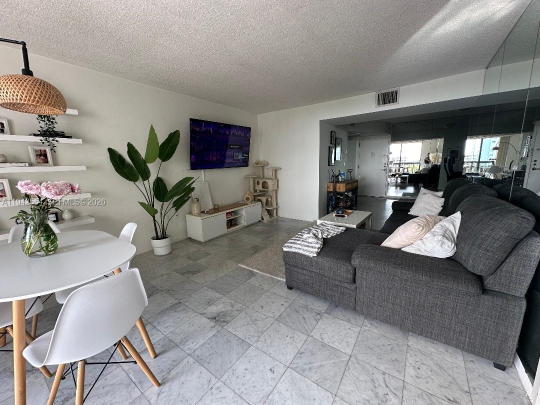 2333 Brickell Avenue, Unit 1108 Miami, FL 33129 - Photo 12 of 17 a living room with furniture