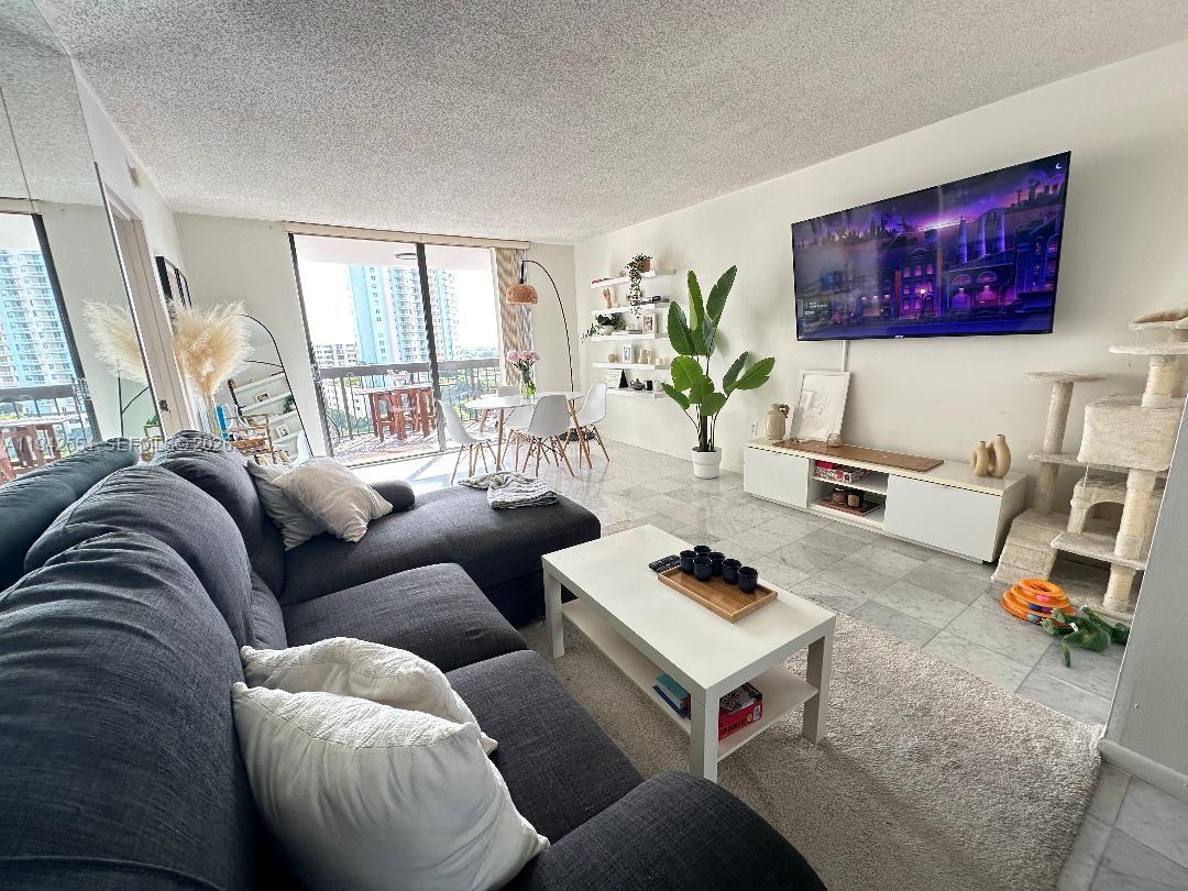 2333 Brickell Avenue, Unit 1108 Miami, FL 33129 - Photo 13 of 17 a living room with furniture and a window
