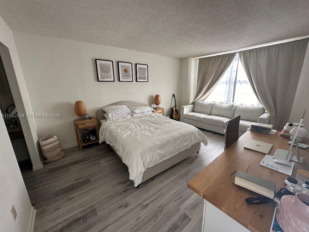 2333 Brickell Avenue, Unit 1108 Miami, FL 33129 - Photo 14 of 17 a bedroom with a bed and a window