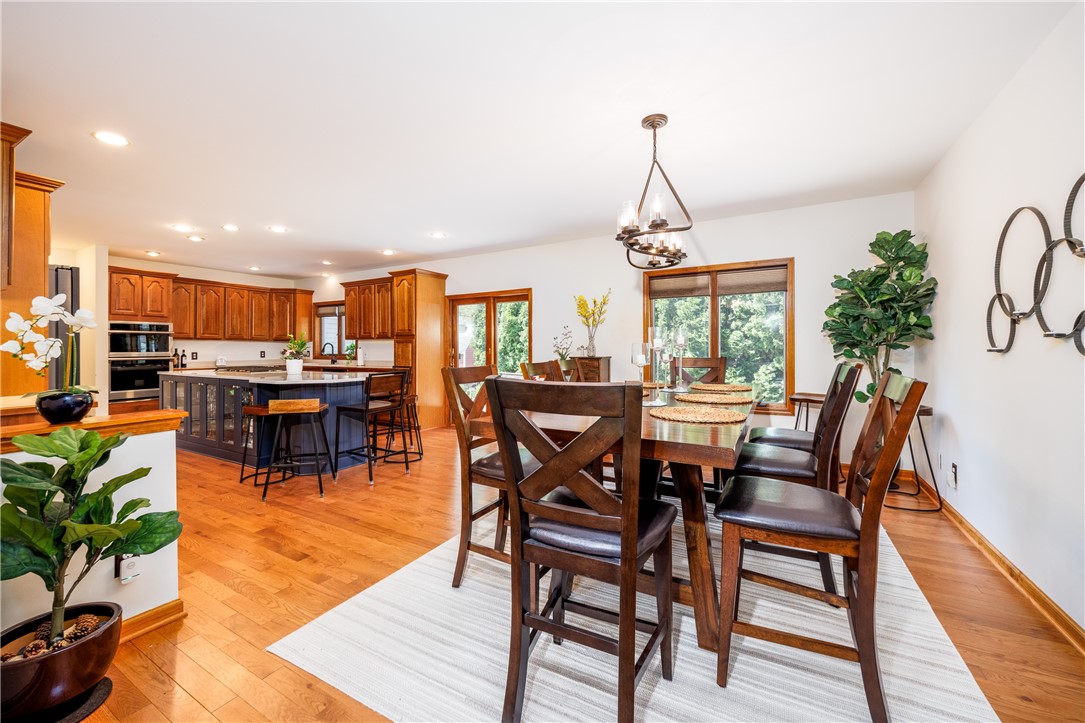 210 Buck Hill Road Greece, NY 14626 - Photo 13 of 49 COOK'S KITCHEN WITH BEAUTIFUL CABINETRY, ISLAND &