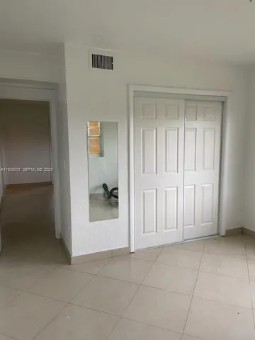 an empty room with a bathroom