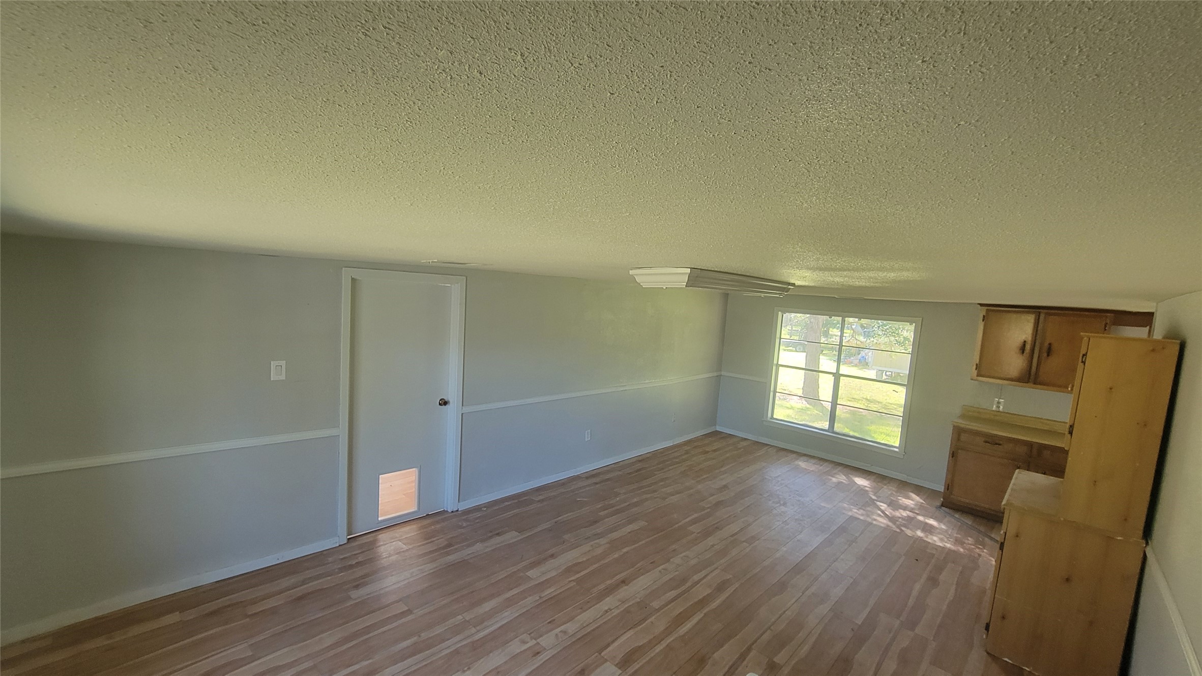 2960 Call Street Vidor, TX 77662 - Photo 15 of 46 wooden floor in an empty room with a window