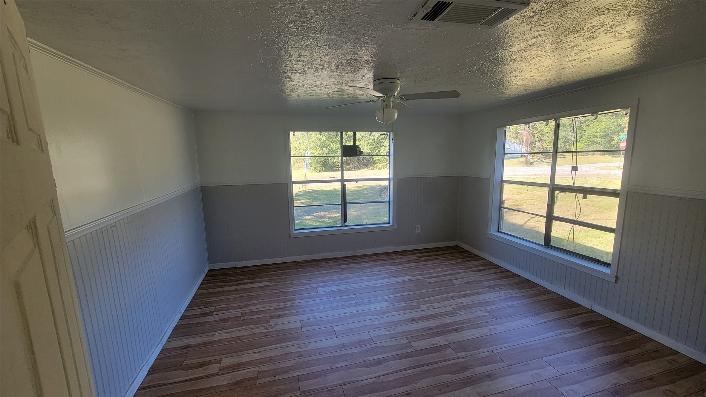 2960 Call Street Vidor, TX 77662 - Photo 28 of 46 a view of an empty room with wooden floor and a window