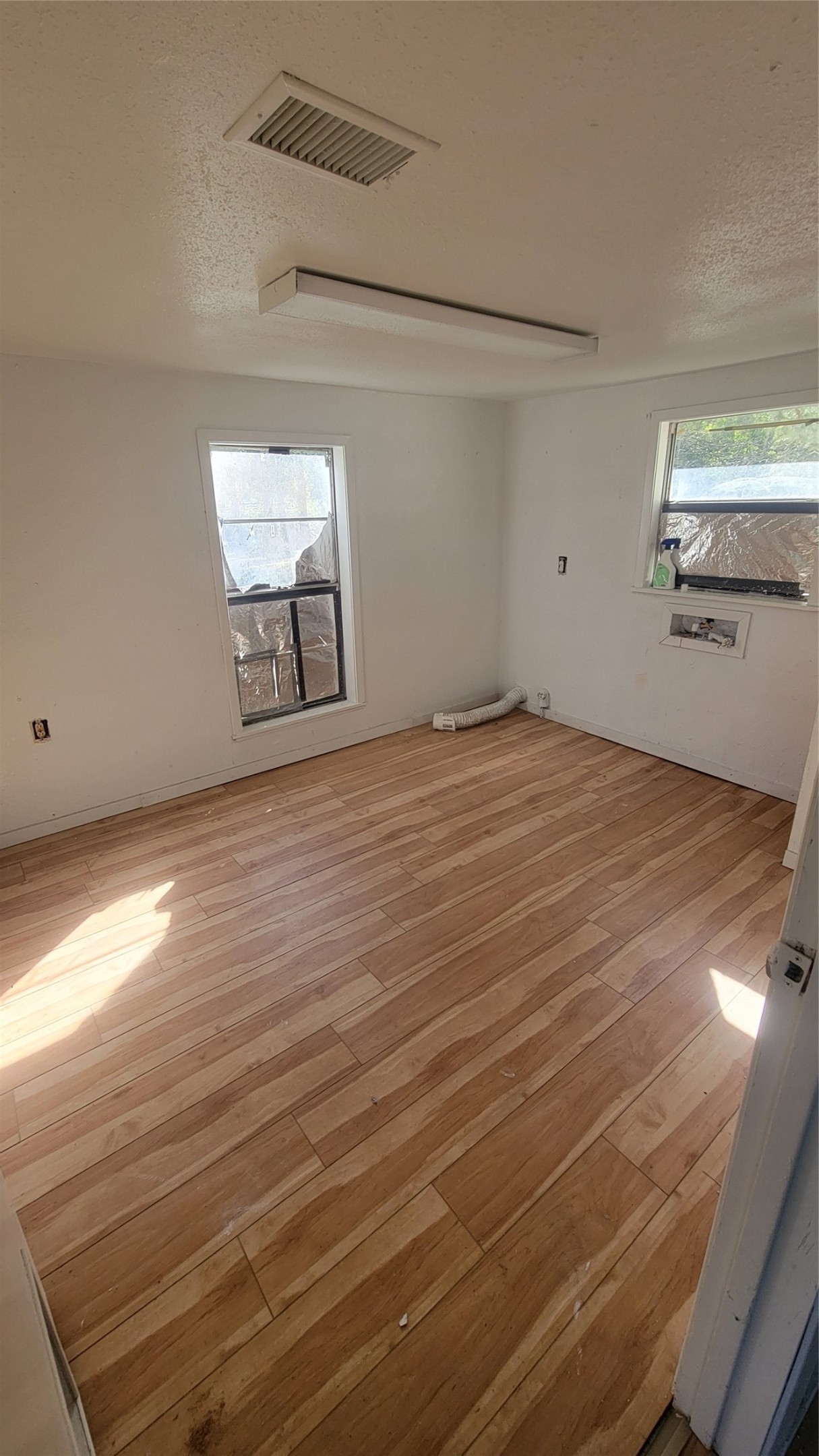 2960 Call Street Vidor, TX 77662 - Photo 9 of 46 a view of an empty room with window and wooden floor