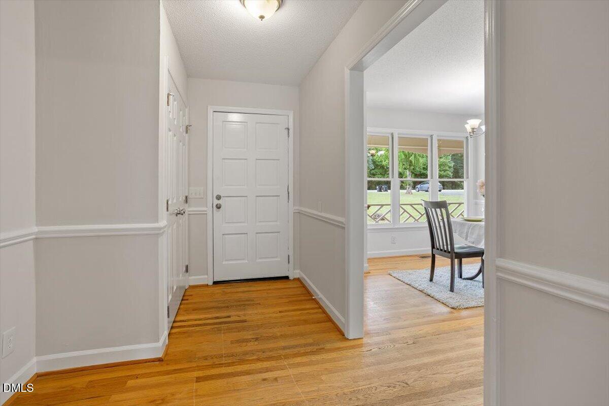 805 Rand Road Garner, NC 27529 - Photo 15 of 38 a view of a room with wooden floor and chair