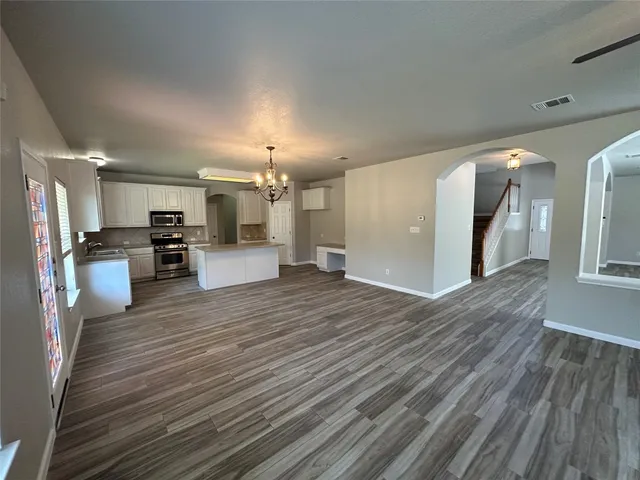 a view of kitchen with cabinets and wooden floor