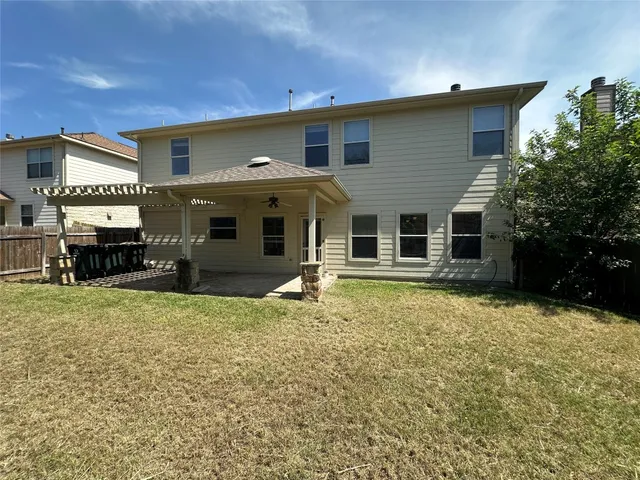 a house view with a backyard space