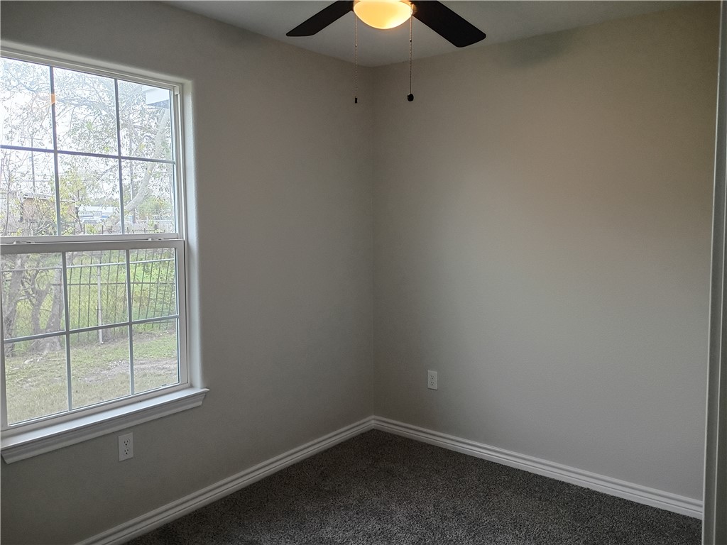 1652 16th Street Corpus Christi, TX 78404 - Photo 14 of 19 an empty room with a window