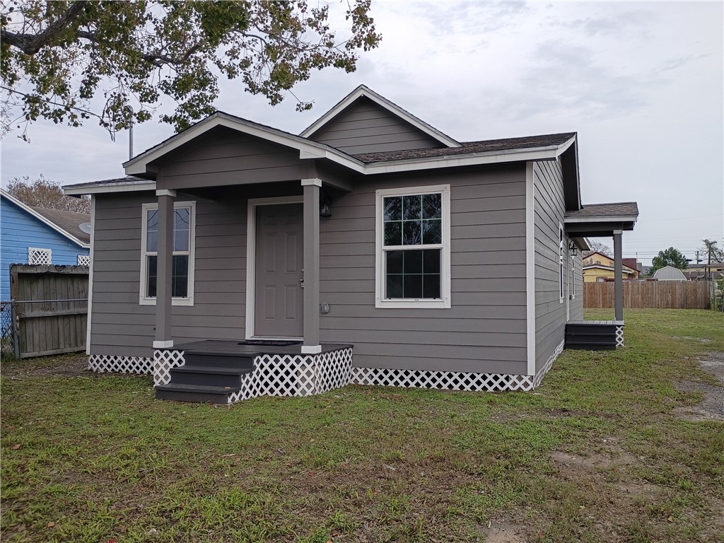 1652 16th Street Corpus Christi, TX 78404 - Photo 2 of 19 a front view of a house with a yard