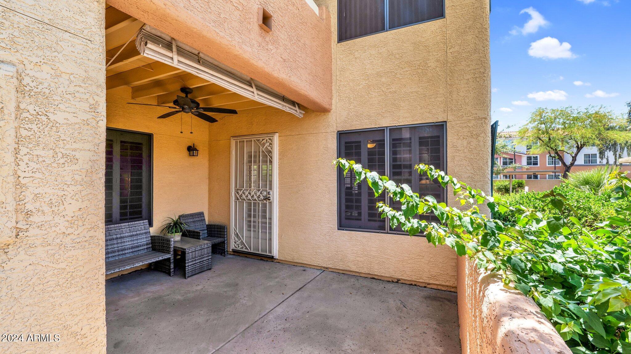 9990 North Scottsdale Road, Unit 1019 Paradise Valley, AZ 85253 - Photo 25 of 30 a view of front door and porch with seating space