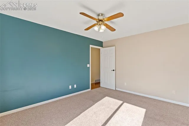 a view of a ceiling fan in a room