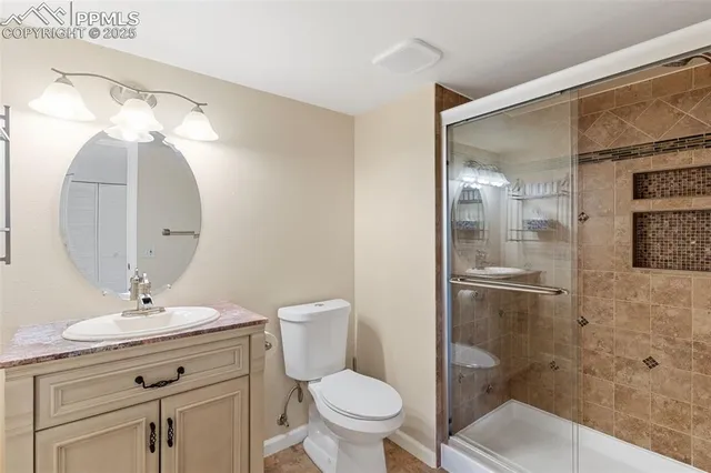 a bathroom with a toilet sink and shower