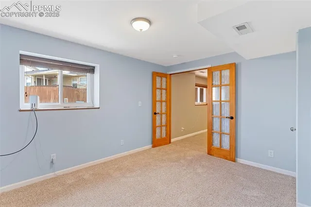 an empty room with windows