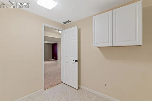a view of a closet area with an empty room