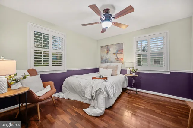 a bed room with a bed and a chair