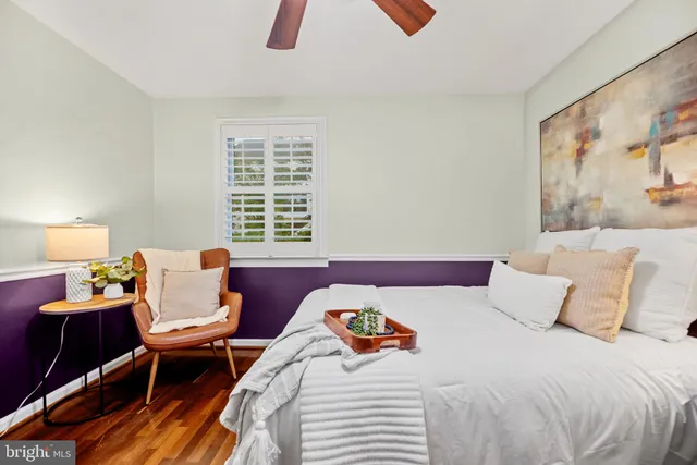 a bedroom with a bed and a couch