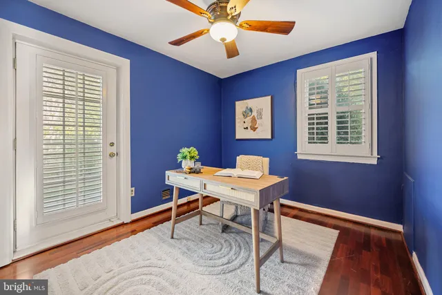 a workspace with furniture and a window