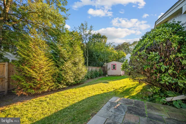 a view of a yard with swimming pool