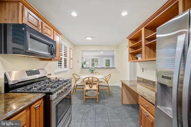 a kitchen with a stove and a microwave