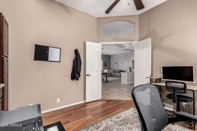 a view of a livingroom with furniture and a flat screen tv