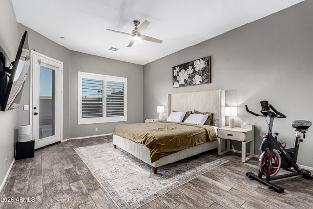 a bedroom with a bed and a chandelier