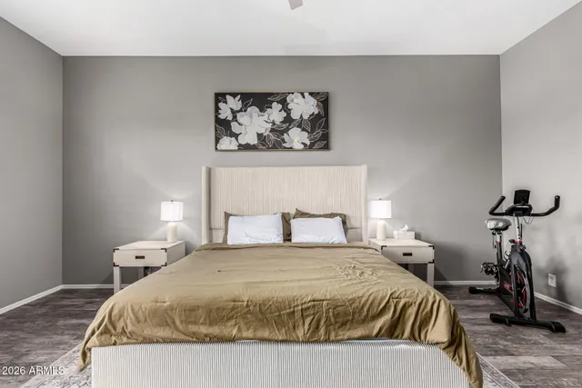 a bedroom with a bed and a table