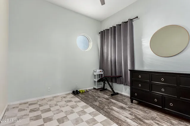 a view of a room with a mirror and a fan