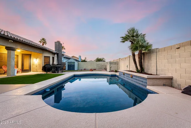 a view of a swimming pool with a lounge chairs