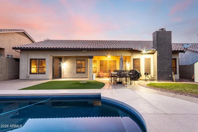a view of swimming pool with outdoor seating
