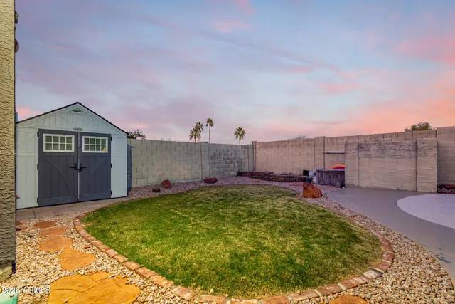 a view of a backyard with sitting area