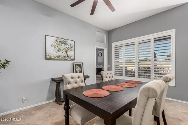 a view of a dining room with furniture window and outside view