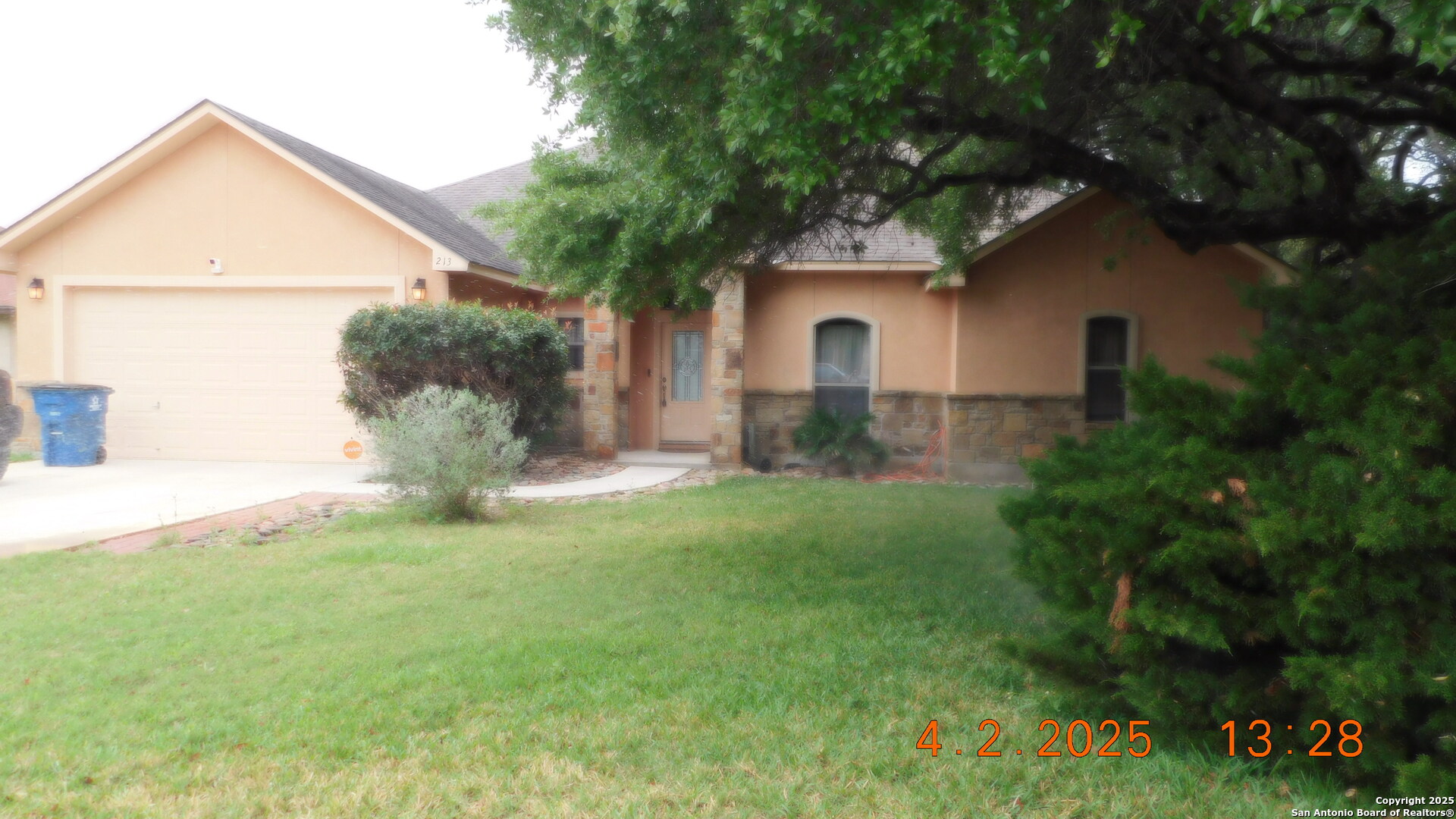 213 Yorktown Pleasanton, TX 78064 - Photo 1 of 1 a front view of a house with garden