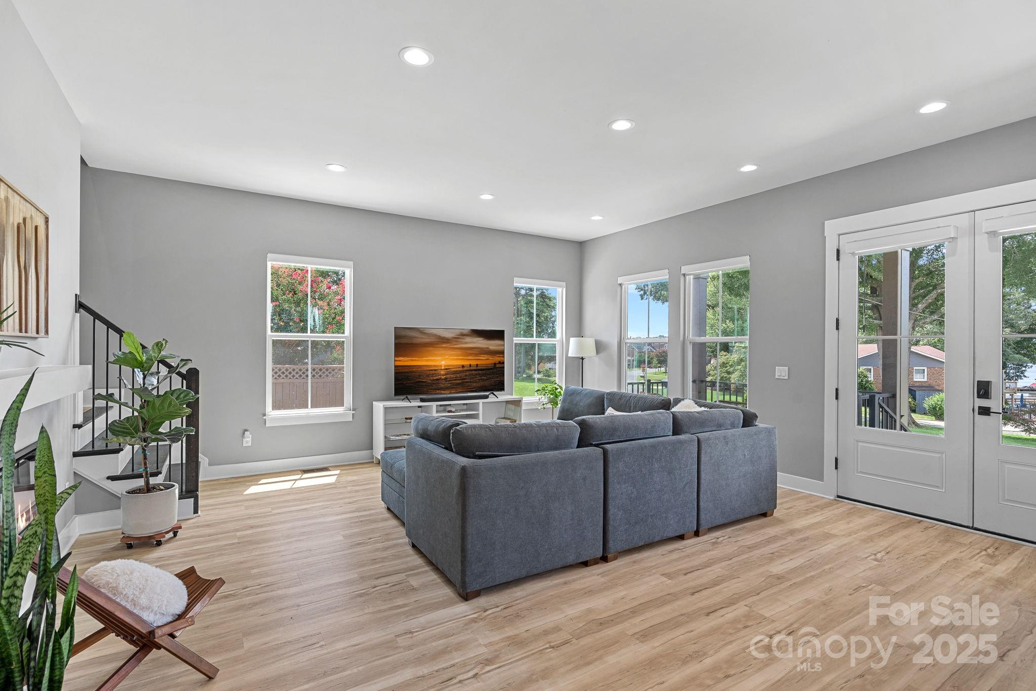20615 Rio Oro Drive Cornelius, NC 28031 - Photo 12 of 40 a living room with furniture and a flat screen tv
