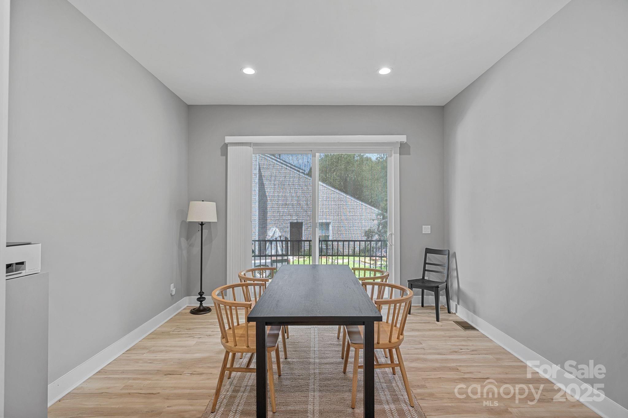 20615 Rio Oro Drive Cornelius, NC 28031 - Photo 14 of 40 a view of a dining room with furniture and window